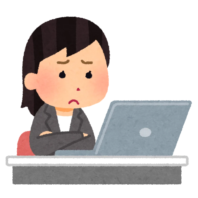 パソコンの前で悩む女性